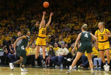 Iowa   s Caitlin Clark (22) attempts a three-point shot against Michigan State Tuesday, Jan. 2, 2024 at Carver-Hawkeye Arena.