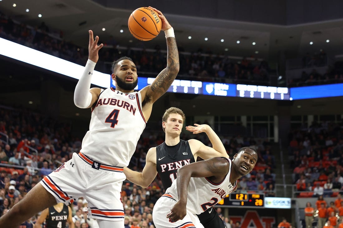 Jan 2, 2024; Auburn, Alabama, USA;  Auburn Tigers forward Johni Broome (4) controls a rebound during the first half against the Pennsylvania Quakers at Neville Arena. Mandatory Credit: John Reed-USA TODAY Sports