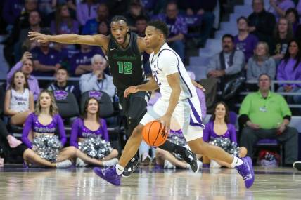 Jan 2, 2024; Manhattan, Kansas, USA; Kansas State Wildcats guard Tylor Perry (2) is guarded by Chicago State Cougars guard Brent Davis (12) during the second half at Bramlage Coliseum. Mandatory Credit: Scott Sewell-USA TODAY Sports