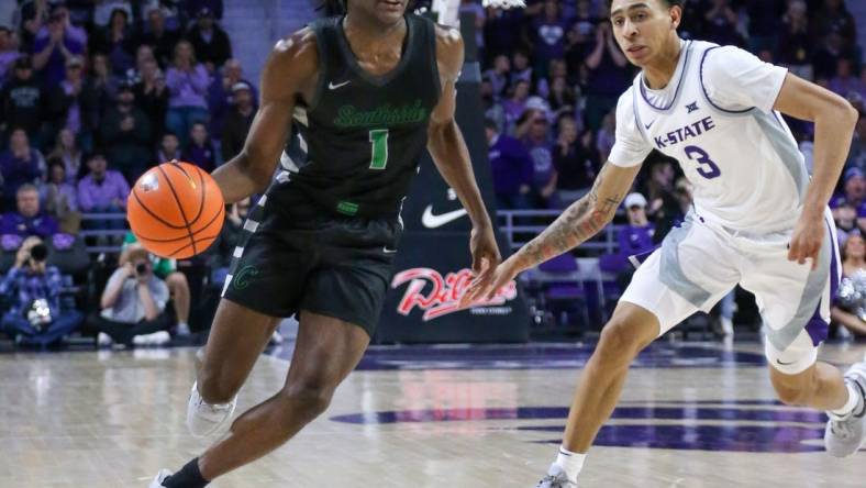 Jan 2, 2024; Manhattan, Kansas, USA; Chicago State Cougars guard Wesley Cardet, Jr.(1) dribbles by Kansas State Wildcats guard Dorian Finister (3) during the second half at Bramlage Coliseum. Mandatory Credit: Scott Sewell-USA TODAY Sports