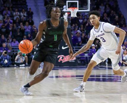 Jan 2, 2024; Manhattan, Kansas, USA; Chicago State Cougars guard Wesley Cardet, Jr.(1) dribbles by Kansas State Wildcats guard Dorian Finister (3) during the second half at Bramlage Coliseum. Mandatory Credit: Scott Sewell-USA TODAY Sports