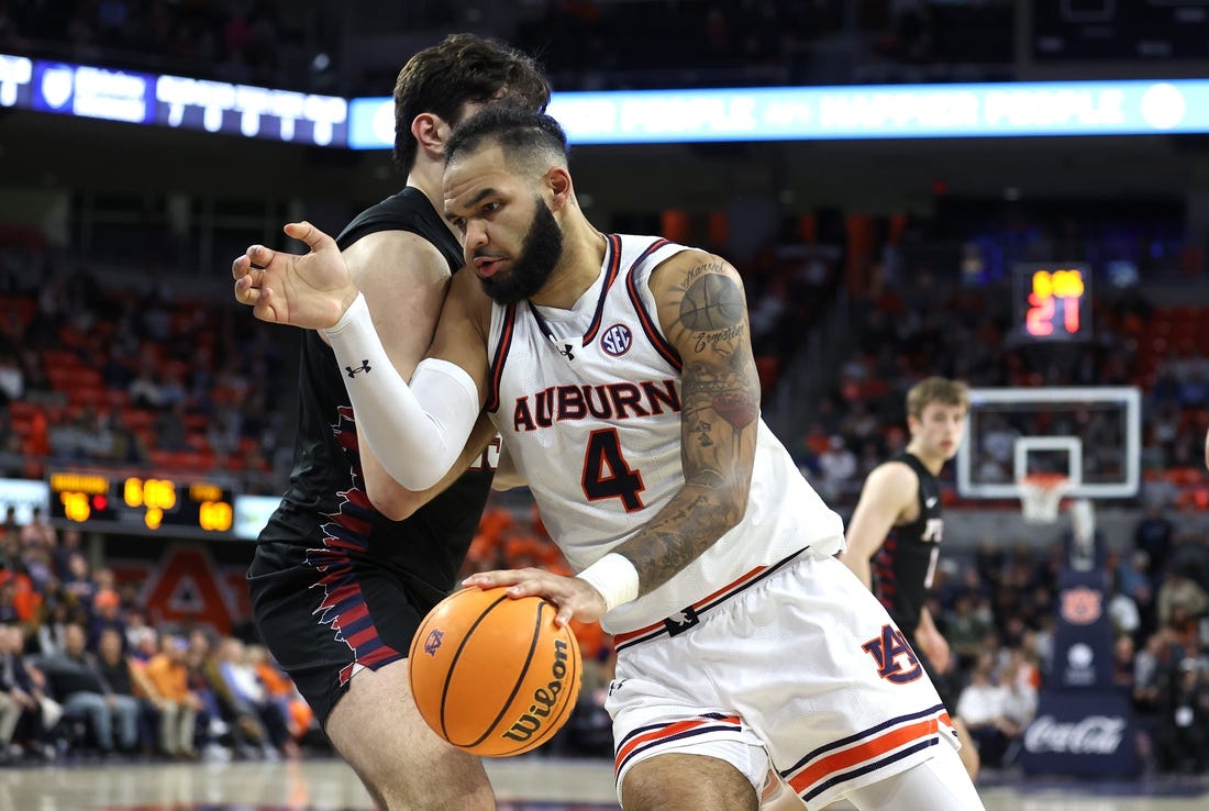 Jan 2, 2024; Auburn, Alabama, USA;  Auburn Tigers forward Johni Broome (4) is the focus of Arkansas' defense this weekend. Mandatory Credit: John Reed-USA TODAY Sports