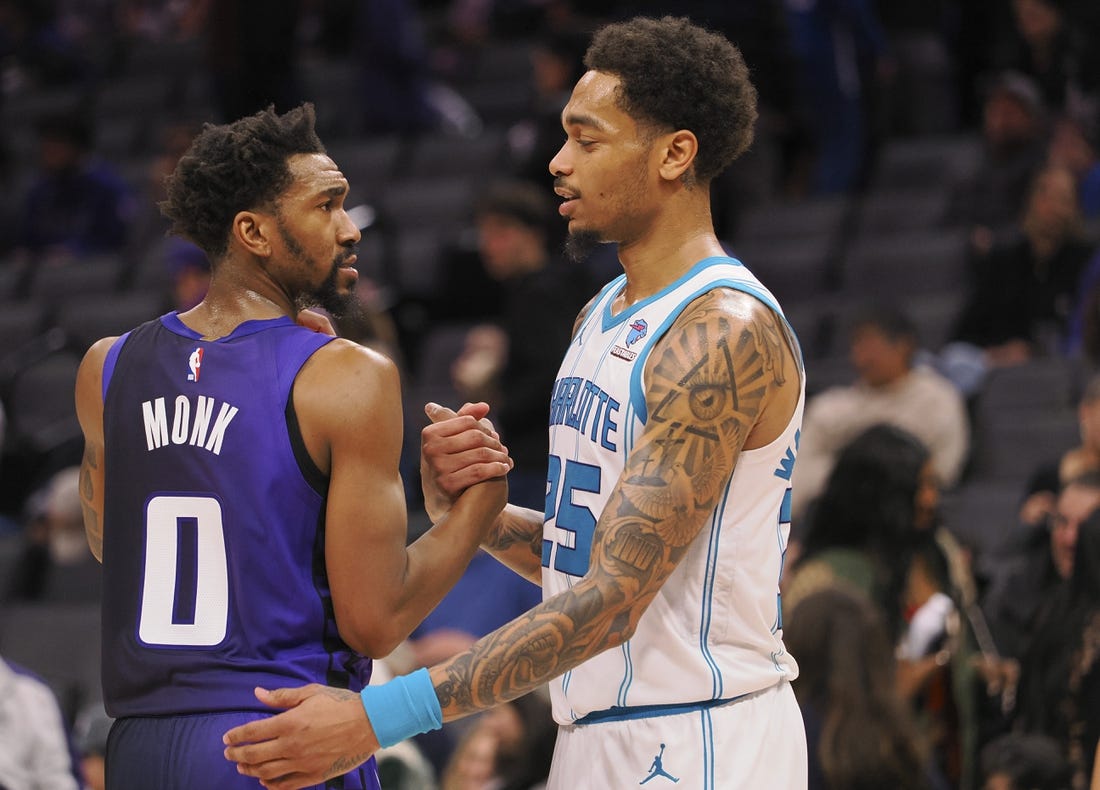 Jan 2, 2024; Sacramento, California, USA; Sacramento Kings guard Malik Monk (0) and Charlotte Hornets forward P.J. Washington Jr. (25) shake hands after the game at Golden 1 Center. Mandatory Credit: Kelley L Cox-USA TODAY Sports