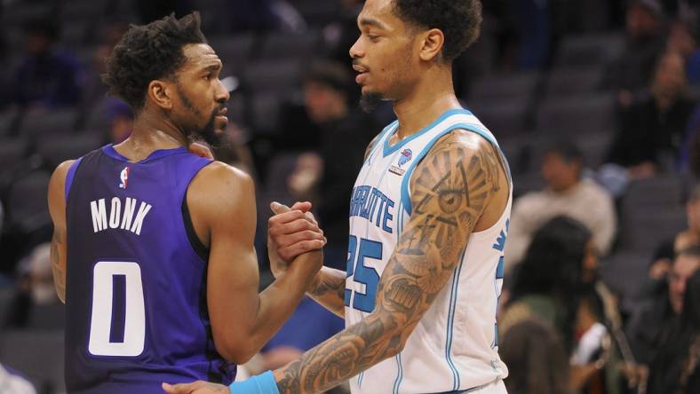 Jan 2, 2024; Sacramento, California, USA; Sacramento Kings guard Malik Monk (0) and Charlotte Hornets forward P.J. Washington Jr. (25) shake hands after the game at Golden 1 Center. Mandatory Credit: Kelley L Cox-USA TODAY Sports