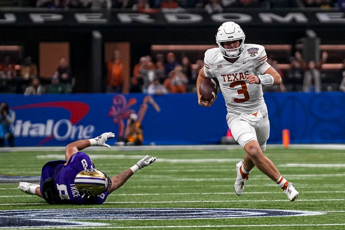 Texas Longhorns quarterback Quinn Ewers (3) evades a tackle by Washington edge Bralen Trice (8) during the Sugar Bowl College Football Playoff  semifinals game at the Caesars Superdome on Monday, Jan. 1, 2024 in New Orleans, Louisiana.