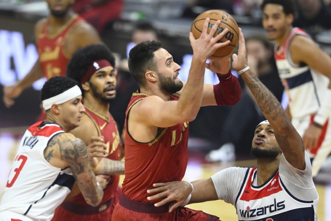 Jan 3, 2024; Cleveland, Ohio, USA; Cleveland Cavaliers guard Max Strus (1) drives against Washington Wizards center Daniel Gafford (21) in the first quarter at Rocket Mortgage FieldHouse. Mandatory Credit: David Richard-USA TODAY Sports