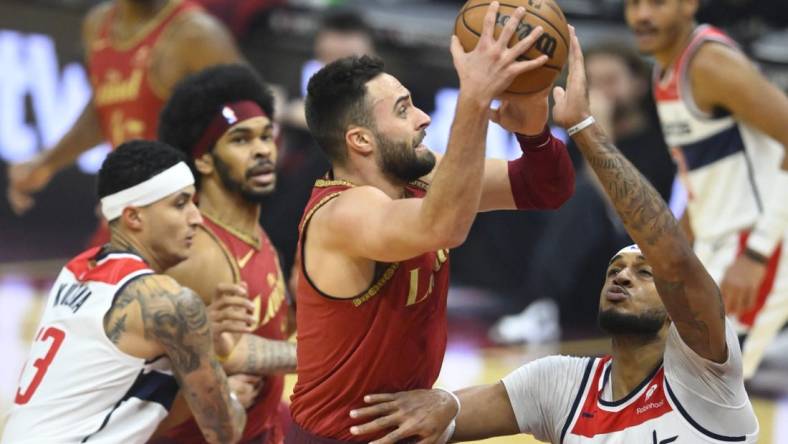 Jan 3, 2024; Cleveland, Ohio, USA; Cleveland Cavaliers guard Max Strus (1) drives against Washington Wizards center Daniel Gafford (21) in the first quarter at Rocket Mortgage FieldHouse. Mandatory Credit: David Richard-USA TODAY Sports