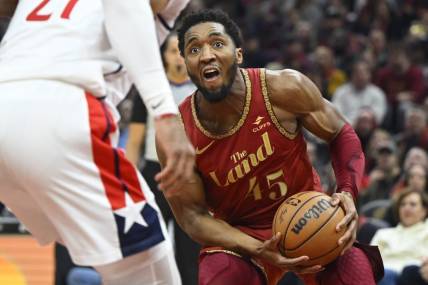 Jan 3, 2024; Cleveland, Ohio, USA; Cleveland Cavaliers guard Donovan Mitchell (45) drives to the basket in the second quarter against the Washington Wizards at Rocket Mortgage FieldHouse. Mandatory Credit: David Richard-USA TODAY Sports