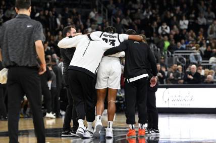 Jan 3, 2024; Providence, Rhode Island, USA; Providence Friars forward Bryce Hopkins (23) is helped by staff after getting injured during the second half against the Seton Hall Pirates at Amica Mutual Pavilion. Mandatory Credit: Eric Canha-USA TODAY Sports