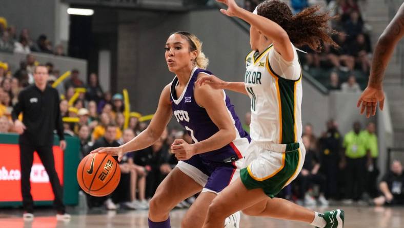 Jan 3, 2024; Waco, Texas, USA;  TCU Horned Frogs guard Jaden Owens (1) controls the ball against Baylor Lady Bears guard Jada Walker (11) during the first half at Paul and Alejandra Foster Pavilion. Mandatory Credit: Chris Jones-USA TODAY Sports