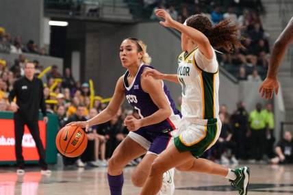 Jan 3, 2024; Waco, Texas, USA;  TCU Horned Frogs guard Jaden Owens (1) controls the ball against Baylor Lady Bears guard Jada Walker (11) during the first half at Paul and Alejandra Foster Pavilion. Mandatory Credit: Chris Jones-USA TODAY Sports