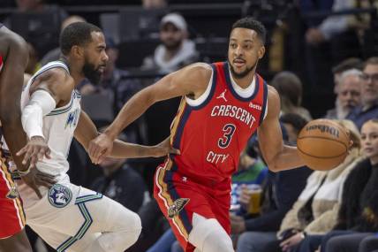 Jan 3, 2024; Minneapolis, Minnesota, USA; New Orleans Pelicans guard CJ McCollum (3) looks to pass the ball around Minnesota Timberwolves guard Mike Conley (10) in the first half at Target Center. Mandatory Credit: Jesse Johnson-USA TODAY Sports