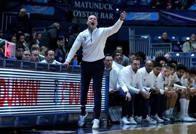 URI coach Archie Miller directing his players from the sidelines.