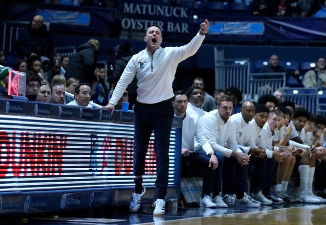 URI coach Archie Miller directing his players from the sidelines.