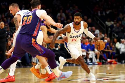 Jan 3, 2024; Phoenix, Arizona, USA; LA Clippers forward Paul George (13) drives to the basket during the second quarter against the Phoenix Suns at Footprint Center. Mandatory Credit: Mark J. Rebilas-USA TODAY Sports