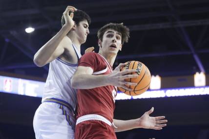 Jan 3, 2024; Los Angeles, California, USA; Stanford Cardinal forward Maxime Raynaud (42) catches the ball as UCLA center Aday Mara (15) defends during the first half at Pauley Pavilion presented by Wescom. Mandatory Credit: Yannick Peterhans-USA TODAY Sports