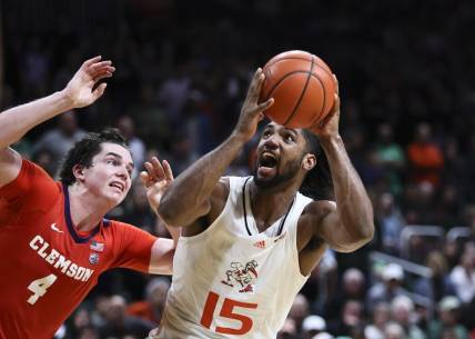 Jan 3, 2024; Coral Gables, Florida, USA; Miami Hurricanes forward Norchad Omier (15) drives to the basket against Clemson Tigers forward Ian Schieffelin (4) during the second half at Watsco Center. Mandatory Credit: Sam Navarro-USA TODAY Sports