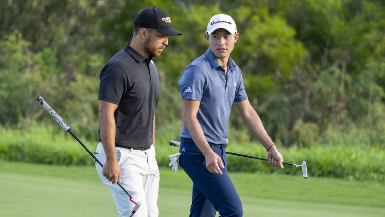 January 4, 2024; Maui, Hawaii, USA; Xander Schauffele (left) and Collin Morikawa (right) walk on the fourth hole during the first round of The Sentry Tournament of Champions golf tournament at Kapalua Golf - The Plantation Course. Mandatory Credit: Kyle Terada-USA TODAY Sports