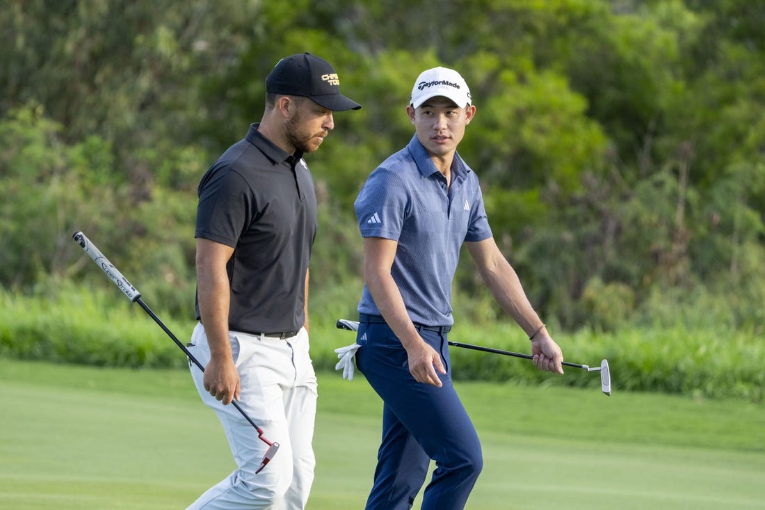 January 4, 2024; Maui, Hawaii, USA; Xander Schauffele (left) and Collin Morikawa (right) walk on the fourth hole during the first round of The Sentry Tournament of Champions golf tournament at Kapalua Golf - The Plantation Course. Mandatory Credit: Kyle Terada-USA TODAY Sports