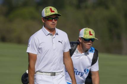 January 4, 2024; Maui, Hawaii, USA; Rickie Fowler (left) and caddie caddie Ricky Romano (right) walk on the fourth hole during the first round of The Sentry Tournament of Champions golf tournament at Kapalua Golf - The Plantation Course. Mandatory Credit: Kyle Terada-USA TODAY Sports