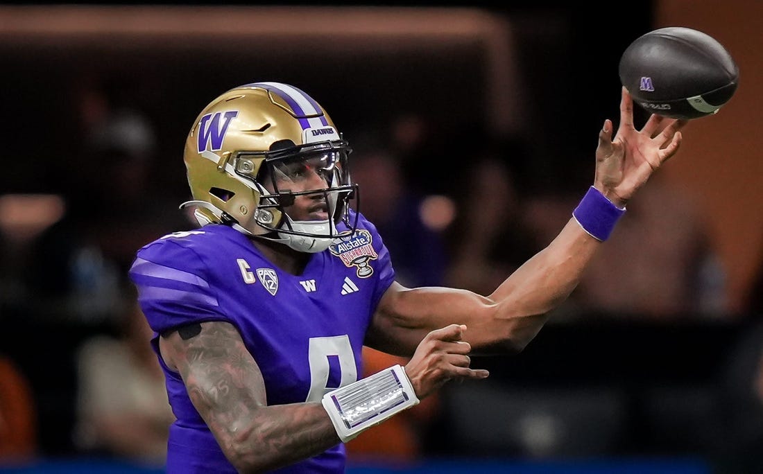 Washington Huskies quarterback Michael Penix Jr. (9) pass the ball during the Sugar Bowl College Football Playoff semi-finals at the Ceasars Superdome in New Orleans, Louisiana, Jan. 1, 2024. The Huskies won the game over the Texas Longhorns 37-31.