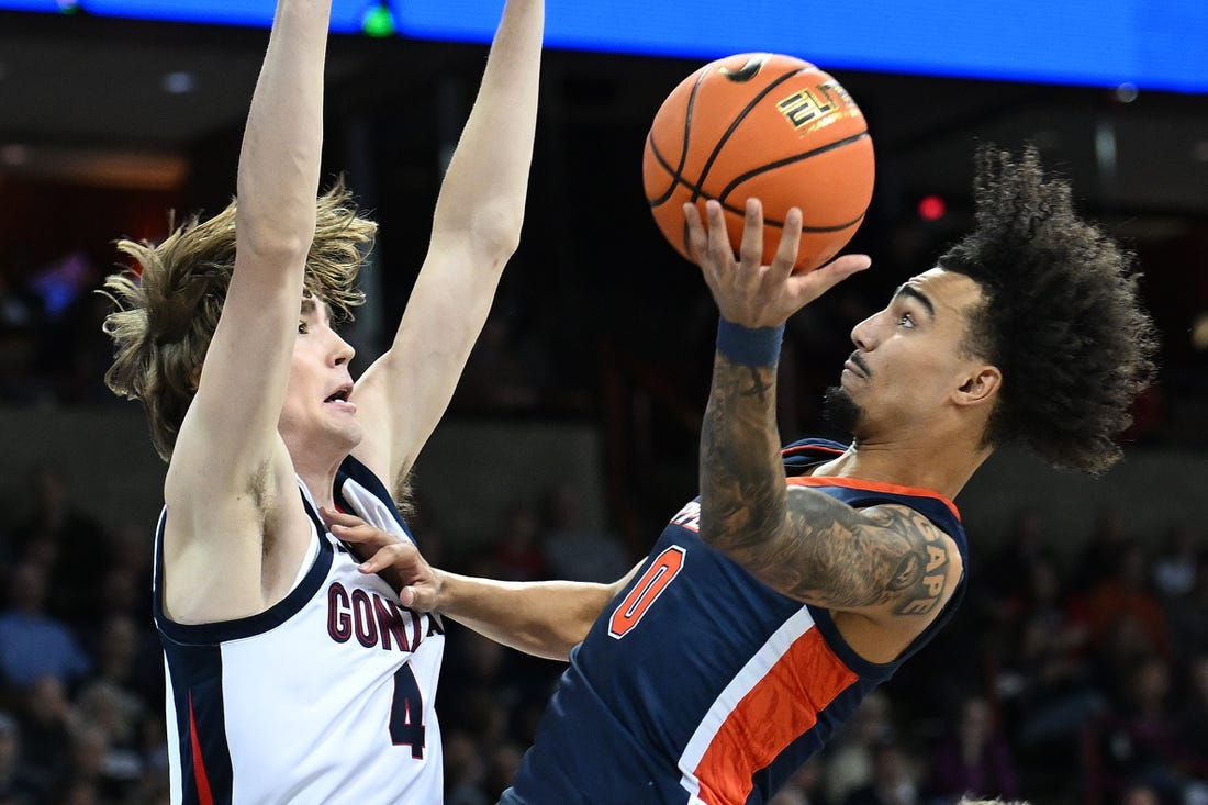 Jan 4, 2024; Spokane, Washington, USA; Pepperdine Waves guard Houston Mallette (0) shoots the ball against Gonzaga Bulldogs guard Dusty Stromer (4) in the first half at Spokane Arena. Mandatory Credit: James Snook-USA TODAY Sports