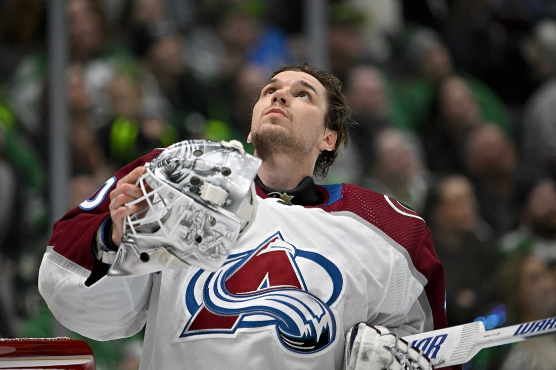 Jan 4, 2024; Dallas, Texas, USA; Colorado Avalanche goaltender Alexandar Georgiev (40) looks up as he puts his helmet back on during a stoppage in play against the Dallas Stars during the second period at the American Airlines Center. Mandatory Credit: Jerome Miron-USA TODAY Sports