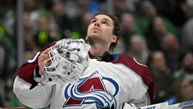 Jan 4, 2024; Dallas, Texas, USA; Colorado Avalanche goaltender Alexandar Georgiev (40) looks up as he puts his helmet back on during a stoppage in play against the Dallas Stars during the second period at the American Airlines Center. Mandatory Credit: Jerome Miron-USA TODAY Sports