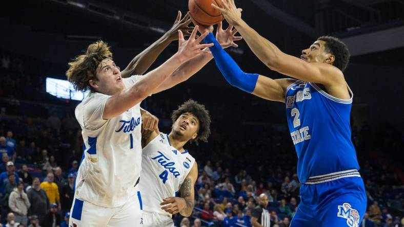 Jan 4, 2024; Tulsa, Oklahoma, USA; Tulsa Golden Hurricane forward Matt Reed (1) and guard PJ Haggerty (4) go for a loose ball against Memphis Tigers forward Nick Jourdain (2) during the second half at the Reynolds Center. The Memphis Tigers won the game 78-75. Mandatory Credit: Brett Rojo-USA TODAY Sports