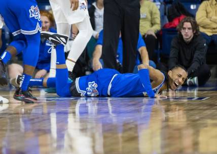 Jan 4, 2024; Tulsa, Oklahoma, USA; Memphis Tigers guard Caleb Mills (9) grimaces in pain after injuring his knee during the first half against the Tulsa Golden Hurricane at the Reynolds Center. The Memphis Tigers won the game 78-75. Mandatory Credit: Brett Rojo-USA TODAY Sports