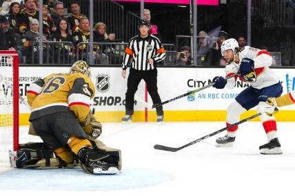 Jan 4, 2024; Las Vegas, Nevada, USA; Florida Panthers center Kevin Stenlund (82) shoots against Vegas Golden Knights goaltender Logan Thompson (36) during the first period at T-Mobile Arena. Mandatory Credit: Stephen R. Sylvanie-USA TODAY Sports