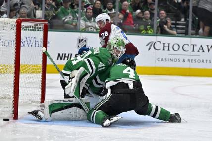 Jan 4, 2024; Dallas, Texas, USA; Dallas Stars defenseman Miro Heiskanen (4) collides with goaltender Scott Wedgewood (41) as they face a shot by Colorado Avalanche left wing Miles Wood (28) during the third period at the American Airlines Center. Mandatory Credit: Jerome Miron-USA TODAY Sports