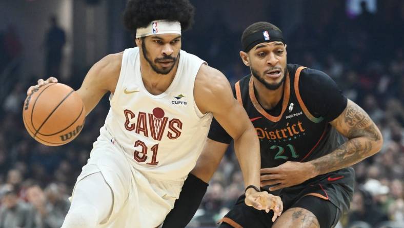 Jan 5, 2024; Cleveland, Ohio, USA; Cleveland Cavaliers center Jarrett Allen (31) drives to the basket against Washington Wizards center Daniel Gafford (21) during the first half at Rocket Mortgage FieldHouse. Mandatory Credit: Ken Blaze-USA TODAY Sports