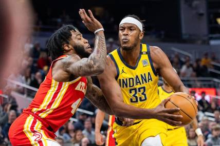 Jan 5, 2024; Indianapolis, Indiana, USA; Indiana Pacers center Myles Turner (33) drives to the basket while Atlanta Hawks forward Saddiq Bey (41) defends in the first quarter at Gainbridge Fieldhouse. Mandatory Credit: Trevor Ruszkowski-USA TODAY Sports