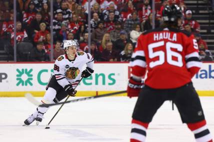 Jan 5, 2024; Newark, New Jersey, USA; Chicago Blackhawks center Connor Bedard (98) skates with the puck against the New Jersey Devils during the first period at Prudential Center. Mandatory Credit: Ed Mulholland-USA TODAY Sports