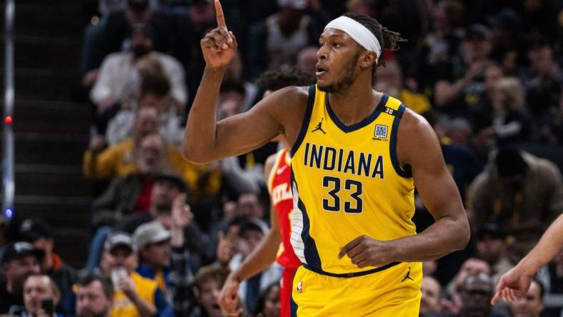 Jan 5, 2024; Indianapolis, Indiana, USA; Indiana Pacers center Myles Turner (33) celebrates a basket  in the second half against the Atlanta Hawks at Gainbridge Fieldhouse. Mandatory Credit: Trevor Ruszkowski-USA TODAY Sports