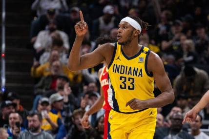 Jan 5, 2024; Indianapolis, Indiana, USA; Indiana Pacers center Myles Turner (33) celebrates a basket  in the second half against the Atlanta Hawks at Gainbridge Fieldhouse. Mandatory Credit: Trevor Ruszkowski-USA TODAY Sports