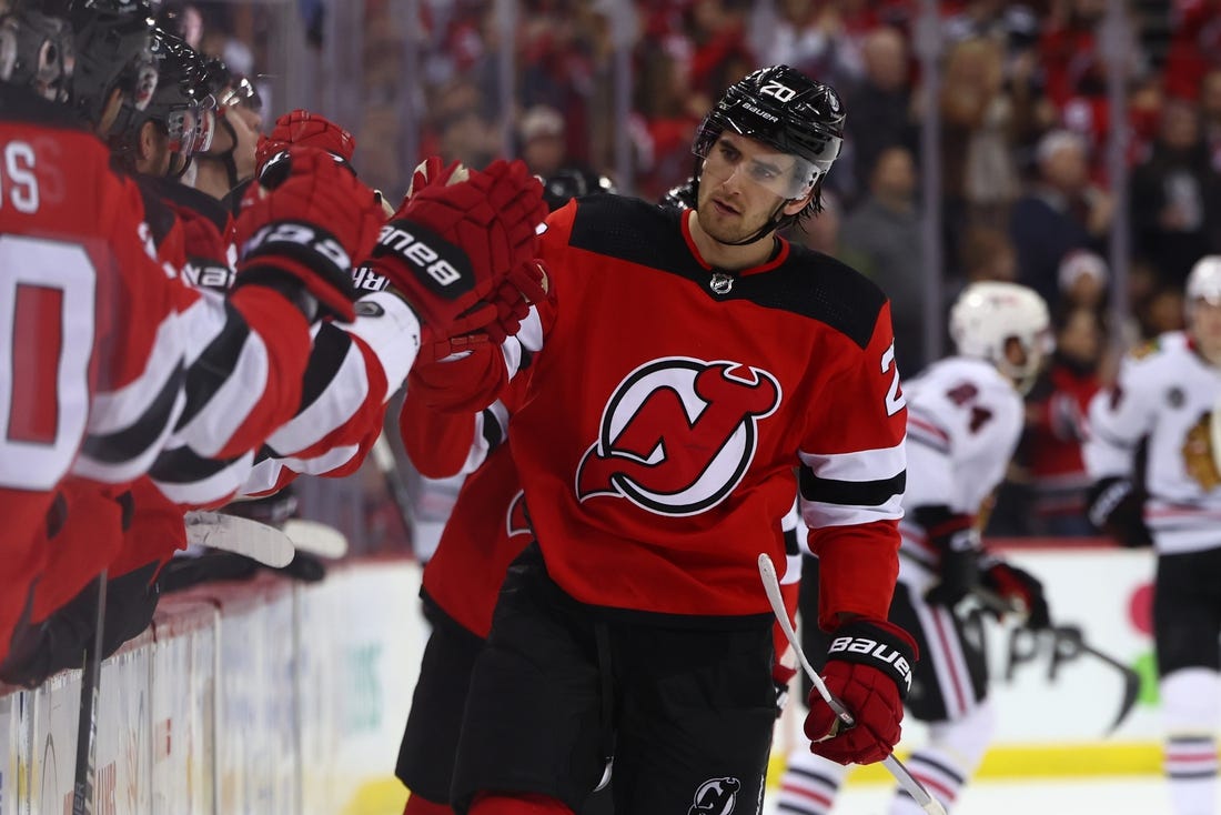 Jan 5, 2024; Newark, New Jersey, USA; New Jersey Devils center Michael McLeod (20) celebrates his goal against the Chicago Blackhawks during the third period at Prudential Center. Mandatory Credit: Ed Mulholland-USA TODAY Sports