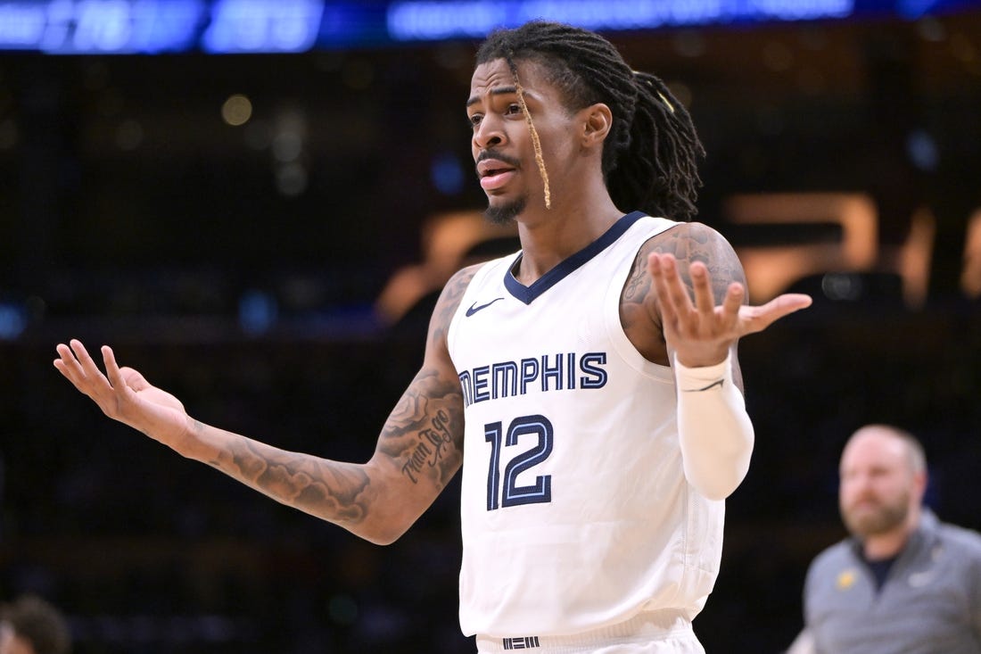 Jan 5, 2024; Los Angeles, California, USA; Memphis Grizzlies guard Ja Morant (12) reacts in the second half against the Los Angeles Lakers at Crypto.com Arena. Mandatory Credit: Jayne Kamin-Oncea-USA TODAY Sports