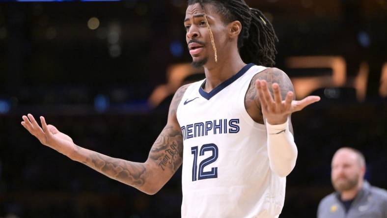 Jan 5, 2024; Los Angeles, California, USA; Memphis Grizzlies guard Ja Morant (12) reacts in the second half against the Los Angeles Lakers at Crypto.com Arena. Mandatory Credit: Jayne Kamin-Oncea-USA TODAY Sports