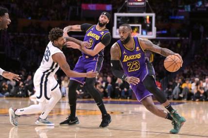 Jan 5, 2024; Los Angeles, California, USA; Los Angeles Lakers forward Anthony Davis (3) screens Memphis Grizzlies guard Marcus Smart (36) as forward LeBron James (23) drives down court in the first half at Crypto.com Arena. Mandatory Credit: Jayne Kamin-Oncea-USA TODAY Sports