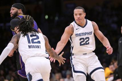 Jan 5, 2024; Los Angeles, California, USA; Memphis Grizzlies guard Desmond Bane (22) is congratulated by guard Ja Morant (12) after a three-point basket in the second half against the Los Angeles Lakers at Crypto.com Arena. Mandatory Credit: Jayne Kamin-Oncea-USA TODAY Sports