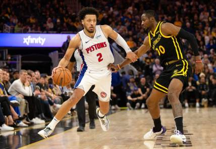 Jan 5, 2024; San Francisco, California, USA; Detroit Pistons guard Cade Cunningham (2) drives around Golden State Warriors guard Stephen Curry (30) during the fourth quarter at Chase Center. Mandatory Credit: D. Ross Cameron-USA TODAY Sports