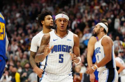 Jan 5, 2024; Denver, Colorado, USA; Orlando Magic forward Paolo Banchero (5) reacts in the fourth quarter against the Denver Nuggets at Ball Arena. Mandatory Credit: Ron Chenoy-USA TODAY Sports