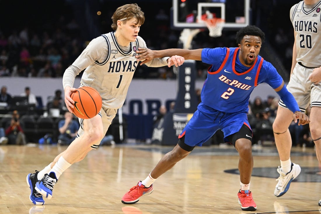 Jan 6, 2024; Washington, District of Columbia, USA; Georgetown Hoyas guard Rowan Brumbaugh (1) dribbles as DePaul Blue Demons guard Chico Carter Jr. (2) defends during the first half at Capital One Arena. Mandatory Credit: Brad Mills-USA TODAY Sports