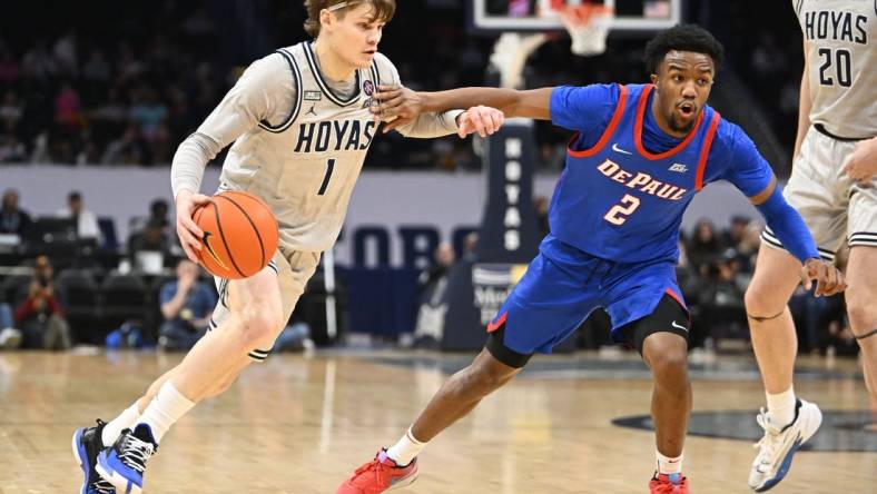 Jan 6, 2024; Washington, District of Columbia, USA; Georgetown Hoyas guard Rowan Brumbaugh (1) dribbles as DePaul Blue Demons guard Chico Carter Jr. (2) defends during the first half at Capital One Arena. Mandatory Credit: Brad Mills-USA TODAY Sports