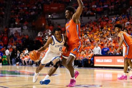 Jan 6, 2024; Gainesville, Florida, USA; Kentucky Wildcats guard Rob Dillingham (0) moves to the basket against Florida Gators forward Tyrese Samuel (4) during the first half at Exactech Arena at the Stephen C. O'Connell Center. Mandatory Credit: Matt Pendleton-USA TODAY Sports