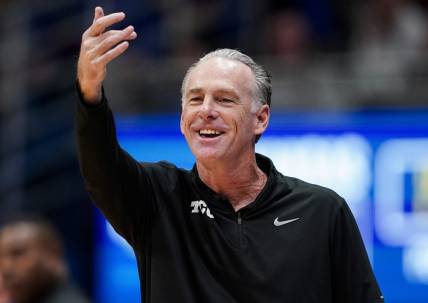 Jan 6, 2024; Lawrence, Kansas, USA; TCU Horned Frogs head coach Jamie Dixon reacts during the first half against the TCU Horned Frogs at Allen Fieldhouse. Mandatory Credit: Jay Biggerstaff-USA TODAY Sports