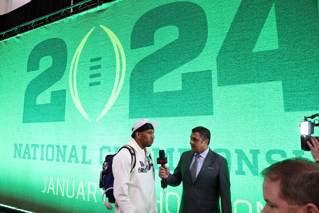 Jan 6, 2024; Houston, TX, USA; Washington Huskies quarterback Michael Penix Jr. (9) talks to the media during media day before the College Football Playoff national championship game against the Michigan Wolverines at George R Brown Convention Center. Mandatory Credit: Troy Taormina-USA TODAY Sports