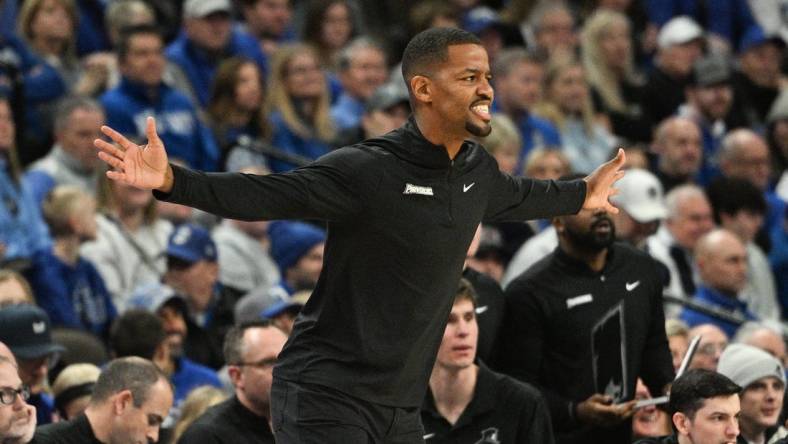 Jan 6, 2024; Omaha, Nebraska, USA; Providence Friars head coach Kim English watches action against the Creighton Bluejays in the first half at CHI Health Center Omaha. Mandatory Credit: Steven Branscombe-USA TODAY Sports